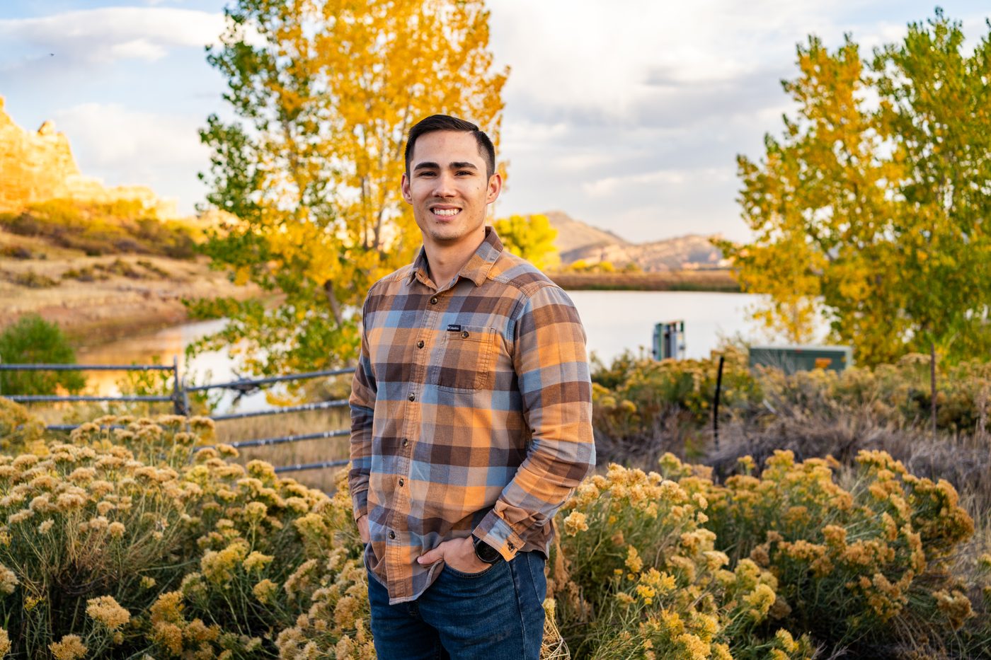 Mason Morrison, founder of High Point Systems Integration, at a Front Range lake in autumn